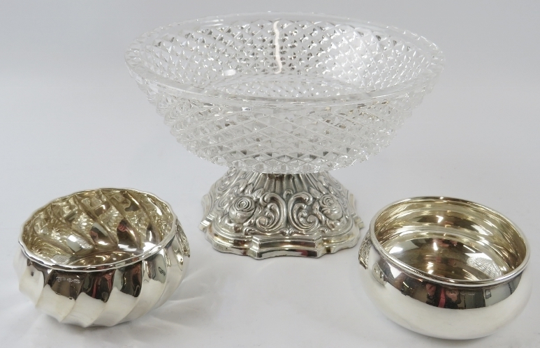 Two small .800 silver bowls and a sterling silver mounted glass fruit bowl. Weighable silver 92