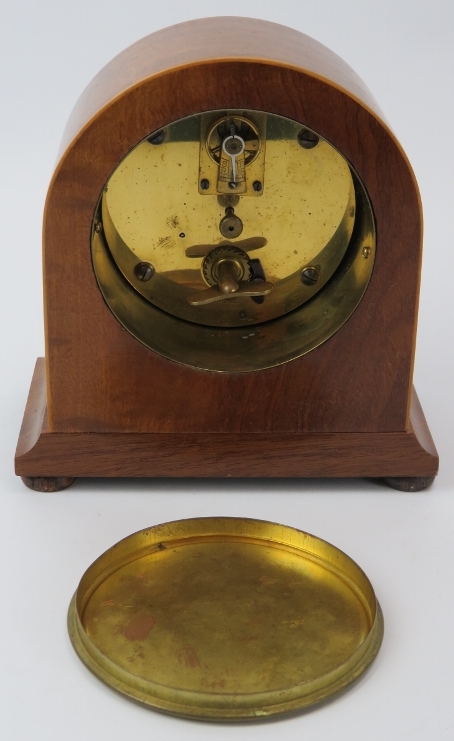A French walnut mantel clock, early 20th century. With satinwood stringing, white enamelled dial and - Image 3 of 3