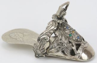 A Peruvian embossed white metal ladies stirrup, 18th/19th century. Of slipper form, decorated with
