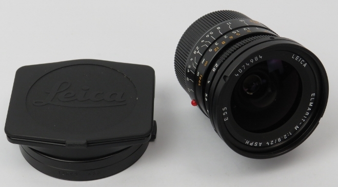 A Leica Elmarit-M 1:2,8 / 24mm ASPH E55 black camera lens. With lens hood (12592) for M 24mm f/2.8 +