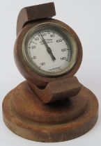 An Art Deco Rototherm fahrenheit wooden desk thermometer, early/mid 20th century. 13.3 cm height.