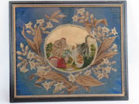 A Victorian needlework tapestry. Decorated with an oval scene depicting two cats and a monkey in a