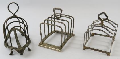 Three four slice silver toast racks including one by Hukin & Heath. All fully hallmarked. Gross