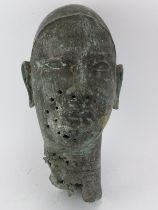 Tribal Art: An African Benin style cast bronze head. 36 cm height. Condition report: Some age