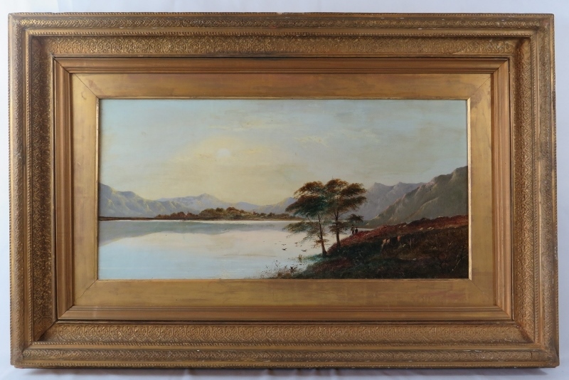 Charles Leslie (1835-1890) - A framed oil on canvas, 'Lake scene with hills beyond with man and