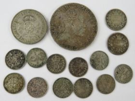 A 19th century Ethiopian silver Birr coin, Menelik II, 40mm diameter, and a quantity of British