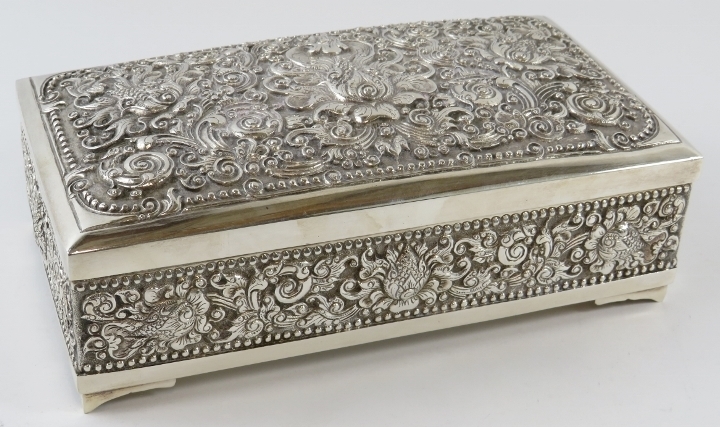 A highly ornate Indonesian silver presentation box with internal inscription. Marked UD 800 to base.
