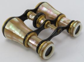 A pair of gilt and enamalled mother pearl opera glasses, 19th/early 20th century. With black leather