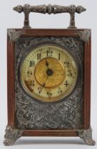 A Victorian oak mantle clock, circa 1889. Design reg: 134844. With silver plated handle, embossed
