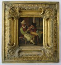 A19th century Dutch oil on tin, mounted in a heavy carved gilt frame, 'Tavern scene', signed