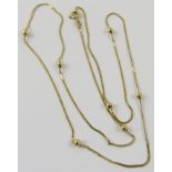 A yellow precious metal bead chain necklace, 62cm long, with bolt ring clasp total weight 3.8gms.