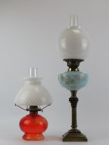 Two French and American brass and glass oil lamps, late 19th/early 20th century. (2 items) 66 cm