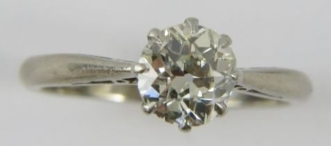 A diamond single stone ring, the lively old cut diamond approximately 1.35cts, claw set in un-