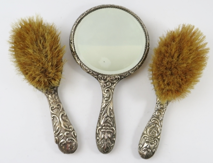 A three piece silver backed vanity set including two brushes and a mirror. All hallmarked for - Image 2 of 3