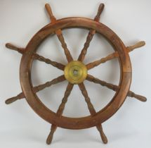 Maritime: A large oak and brass eight spoke ship’s wheel, probably late 19th/early 20th century. 107