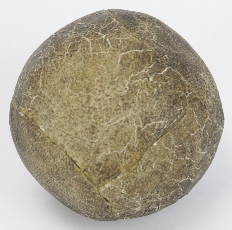An antique feather golf ball, 19th century. Stitched leather exterior. 4.6 cm diameter. Condition