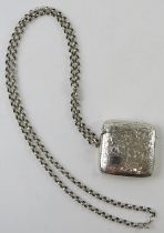 An engraved silver vesta case on an unmarked white metal keep chain. Vesta case hallmarked for