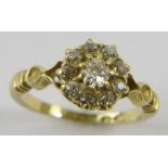 A last Victorian 18ct yellow gold diamond cluster ring, the old cut diamonds total estimated