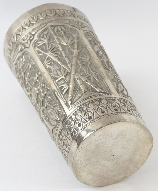 A Far Eastern hand decorated white metal beaker with floral and bamboo panels. Height 14.5cm. - Image 3 of 3