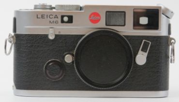 A Leica M6 TTL 0.85 silver chrome finish rangefinder camera body. Box, carry strap and