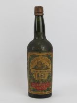 A vintage bottle of F Chamisso Filho & Silva porto, dated 1851. Condition report: Some age related