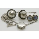 Two pairs of Georg Jensen silver earrings, one set with cabochon moonstones; and a round pendant