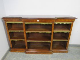 A 19th century walnut breakfront low open bookcase, having six height adjustable oak shelves, the