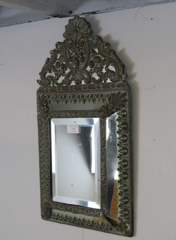 A 19th century Napoleon III cushion wall mirror, the sectioned mirror plates within a brass repousse - Image 2 of 3