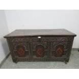 A late 17/early 18th century oak panelled coffer, having internal candle box, the front profusely