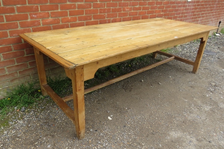 An antique pine refectory style farmhouse table, the planked top on square supports united by an ‘H’ - Image 2 of 3