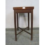 An Arts & Crafts Period oak plant stand, the galleried top with reeded edge, on inner chamfered