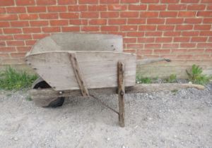 A weathered antique oak garden wheelbarrow. H72cm W155cm D67cm (approx). Condition report: Sides