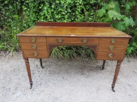 A 19th century mahogany kneehole desk, crossbanded and strung with satinwood, housing a