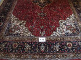 A fine Persian Kashan carpet. Central medallion on red ground. 305 x 79cms Condition report: Very