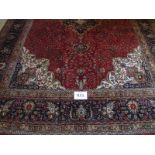 A fine Persian Kashan carpet. Central medallion on red ground. 305 x 79cms Condition report: Very