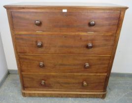 An unusual Victorian mahogany chest, the top section with fall front, opening onto a fitted interior