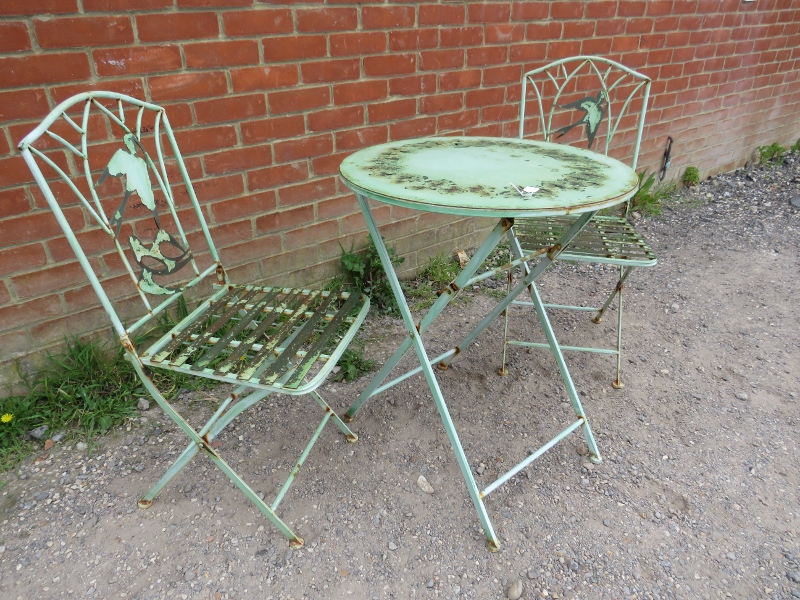 A vintage steel garden set painted green comprising a circular folding table with pierced swallow - Image 2 of 3