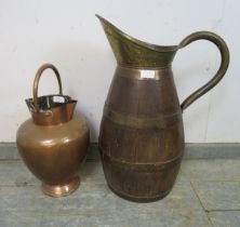 An antique coopered oak and brass ewer, together with a 19th century copper double spouted ewer.