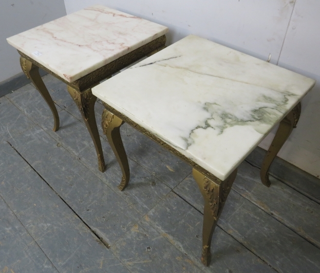 A pair of vintage giltwood side tables, having loose white marble tops, on bases with friezes