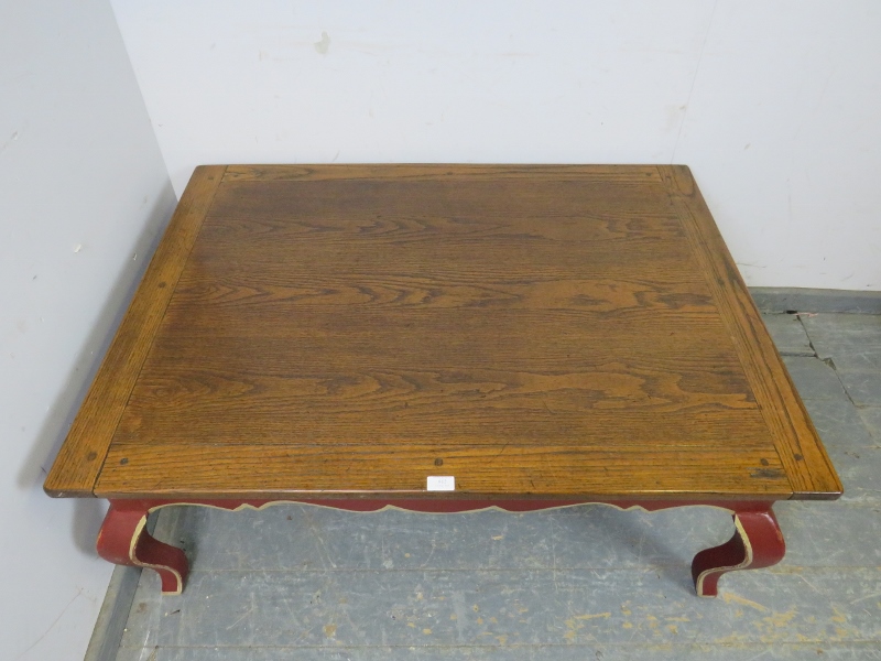 A reproduction oak rectangular coffee table, the burgundy painted base with shaped frieze above ogee - Image 3 of 3