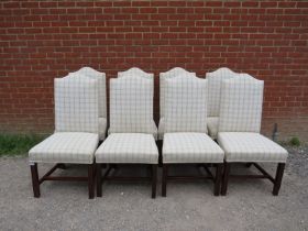 A set of eight antique Georgian Revival mahogany camel back dining chairs, reupholstered in