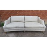 A large contemporary knoll style sofa by Duresta, the drop sides with turned fruitwood finials,