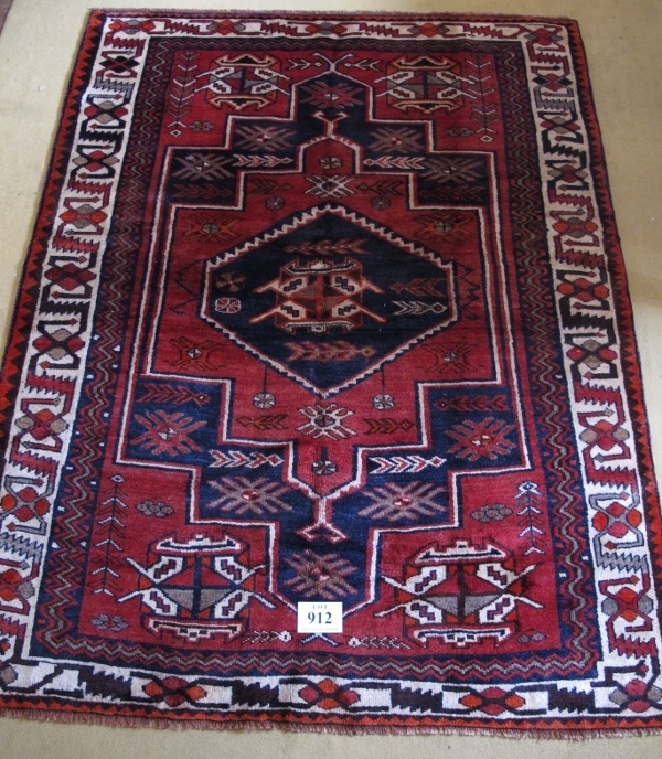 South West Persian Lori rug. Central six sided motif, blue on mellow red ground, geometric pattern - Image 2 of 3