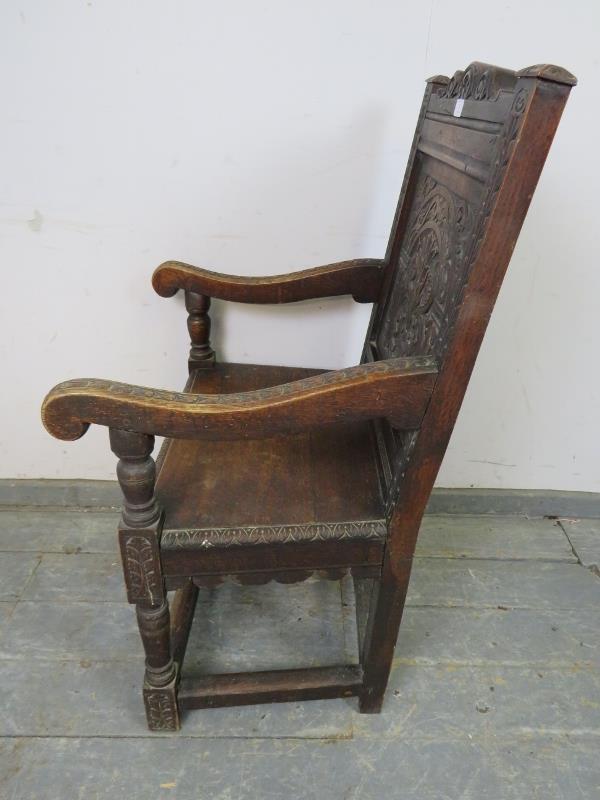 A 19th century oak Wainscott chair in the 17th century taste, the backrest profusely carved with - Image 3 of 4