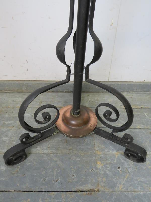 An Art Nouveau floor-standing wrought iron and copper oil lamp, on scrolled tripod supports. - Image 3 of 3