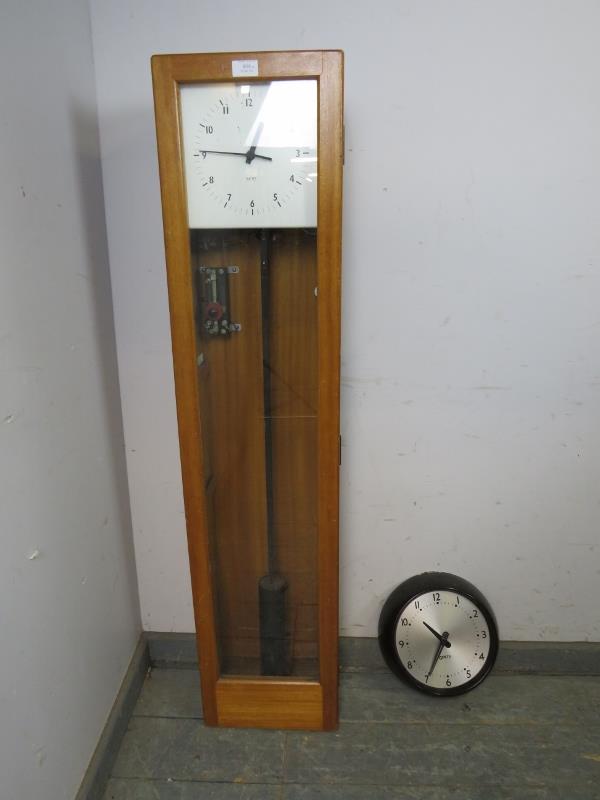 A vintage beech cased electric wall clock set by Gent of Leicester, comprising a master clock with