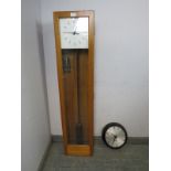 A vintage beech cased electric wall clock set by Gent of Leicester, comprising a master clock with