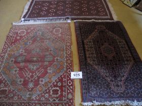 Three 20th Century Persian rugs. Light blue red and blue C.1940 114 x 81cms, blue/cream C.1980 110 x