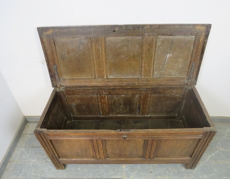 An early 18th century medium oak panelled coffer, retaining the original hinges, on stile - Image 3 of 3