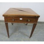 An Edwardian mahogany inlaid and crossbanded envelope card table, having one long frieze drawer,
